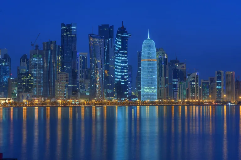 تأشيرة قطر للمصريين — West Bay district of Doha seen from the corniche at night